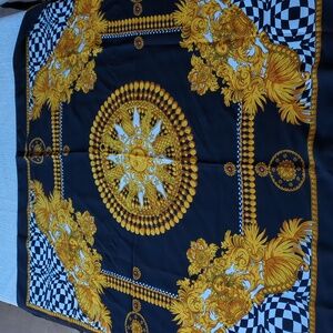 vintage Italian polyester scarf featuring a black and gold sun and chain print